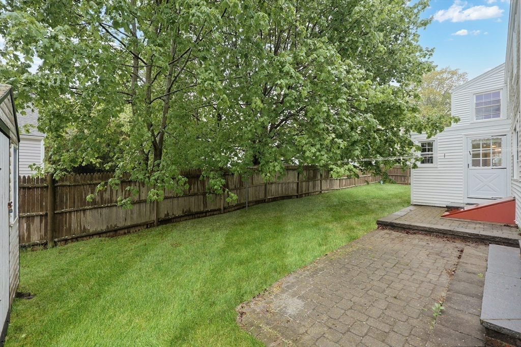 17 Sagamore Road Belmont, MA 02478 - Photo 33 of 35 a view of a backyard with wooden fence