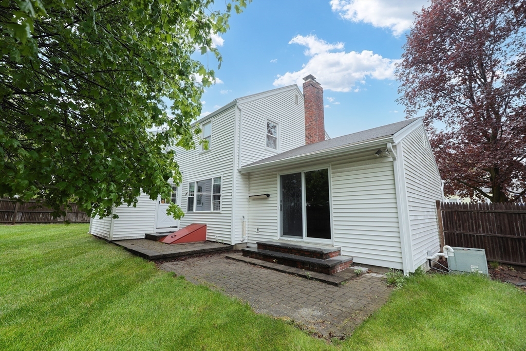 17 Sagamore Road Belmont, MA 02478 - Photo 34 of 35 a backyard of a house with table and chairs