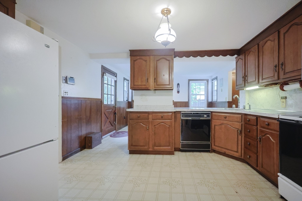 17 Sagamore Road Belmont, MA 02478 - Photo 4 of 35 a kitchen with stainless steel appliances granite countertop a stove and cabinets