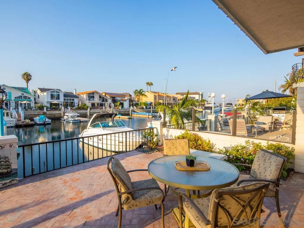 51 Green Turtle Road Coronado, CA 92118 - Photo 14 of 46 a table and chairs in a balcony