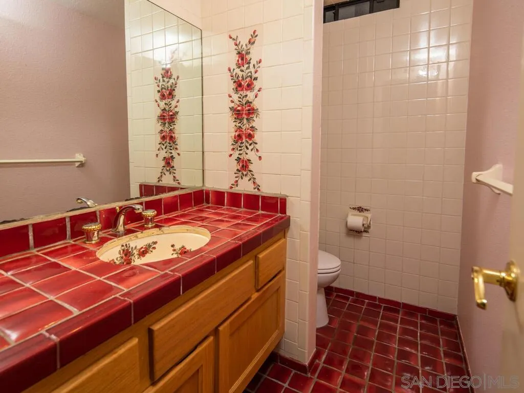 51 Green Turtle Road Coronado, CA 92118 - Photo 21 of 46 a bathroom with a sink toilet and shower