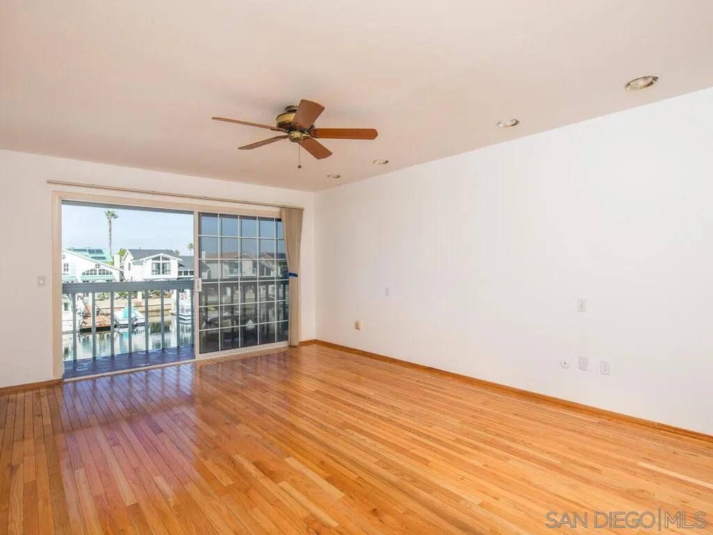 51 Green Turtle Road Coronado, CA 92118 - Photo 26 of 46 a view of empty room with wooden floor and fan
