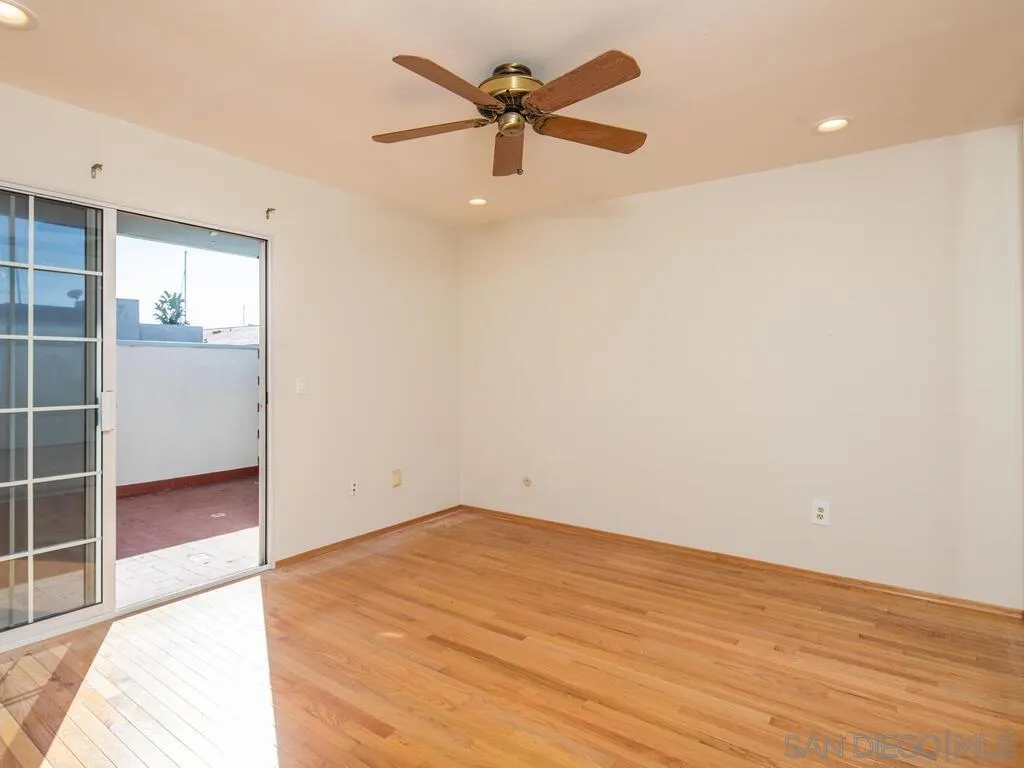51 Green Turtle Road Coronado, CA 92118 - Photo 33 of 46 wooden floor in an empty room with a window