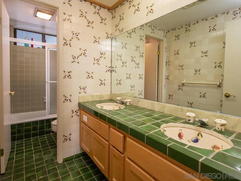 51 Green Turtle Road Coronado, CA 92118 - Photo 34 of 46 a bathroom with a granite countertop sink and a shower