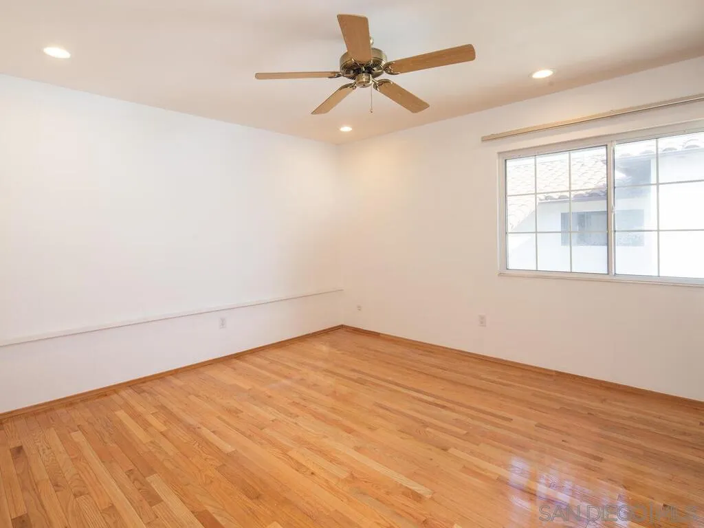 51 Green Turtle Road Coronado, CA 92118 - Photo 35 of 46 an empty room with a window and a fan