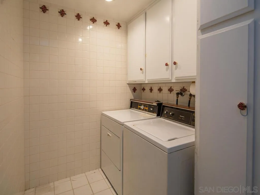 51 Green Turtle Road Coronado, CA 92118 - Photo 36 of 46 a utility room with dryer and washer