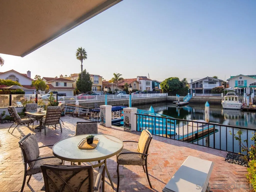 51 Green Turtle Road Coronado, CA 92118 - Photo 39 of 46 a dining room with furniture and a potted plant