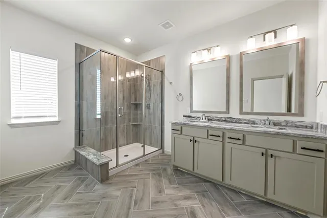 a bathroom with a double vanity sink mirror and double