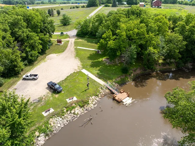 a view of a lake with huge green field