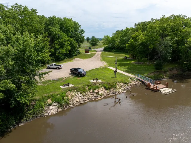 a view of a lake with green space