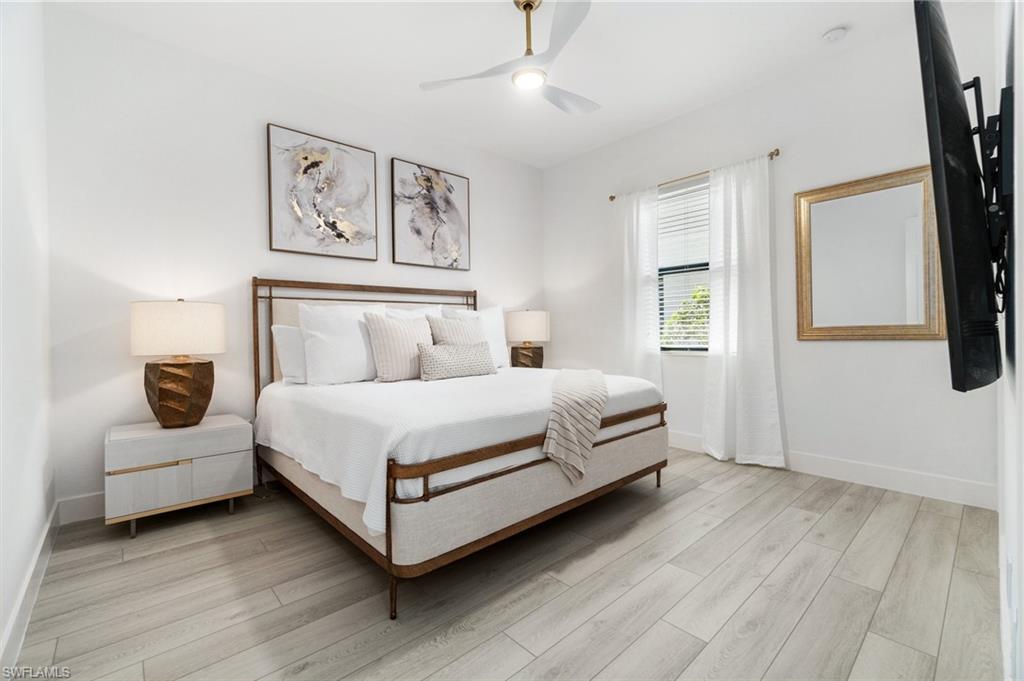 3440 Runaway Lane Naples, FL 34114 - Photo 23 of 42 Bedroom with light wood-style flooring and ceiling fan