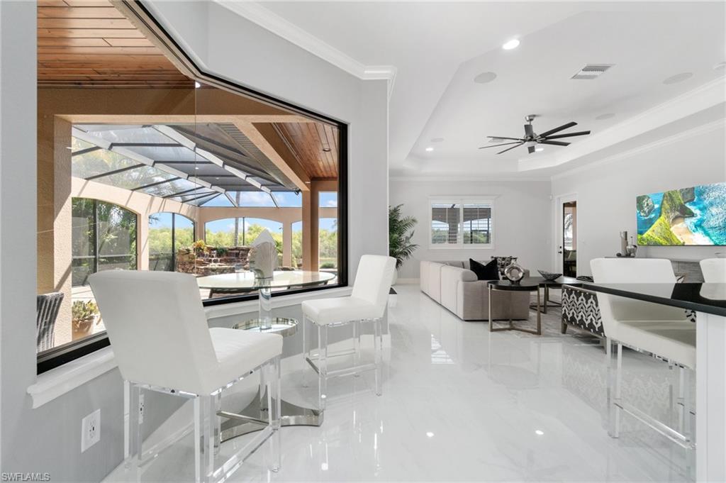 3440 Runaway Lane Naples, FL 34114 - Photo 7 of 42 Dining area with ornamental molding, marble tiled flooring, ceiling fan, and recessed lighting