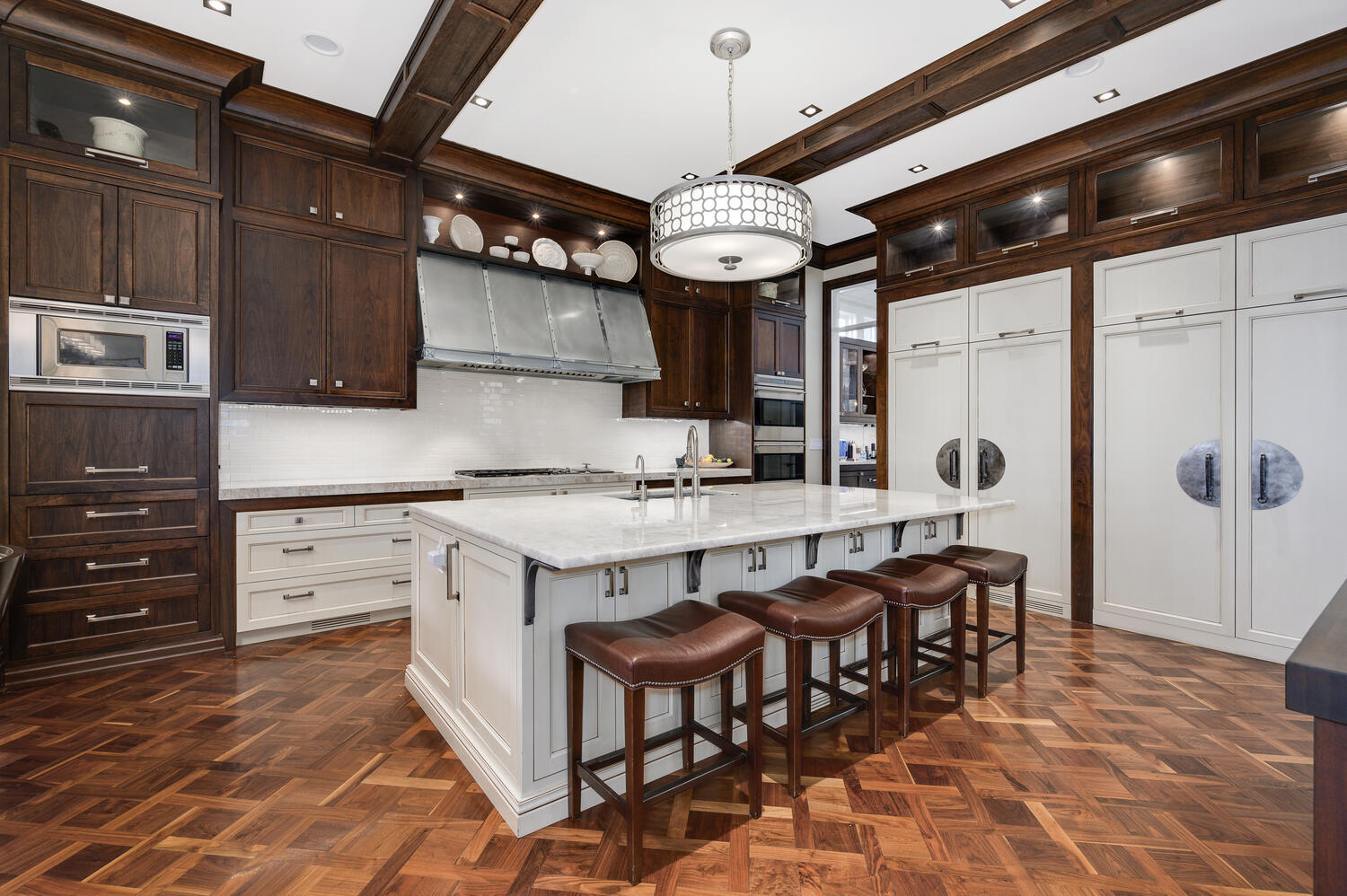 4136 North Greenview Avenue Chicago, IL 60613 - Photo 14 of 56 a kitchen with a cabinets and chandelier