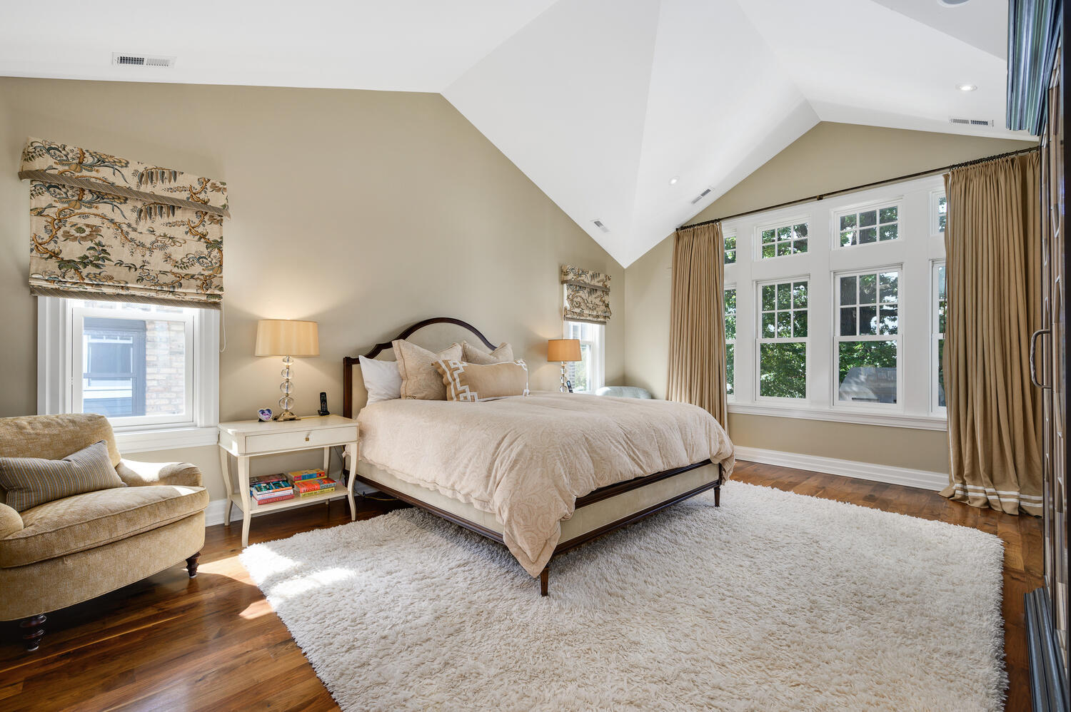 4136 North Greenview Avenue Chicago, IL 60613 - Photo 24 of 56 a bedroom with a large bed and a couch