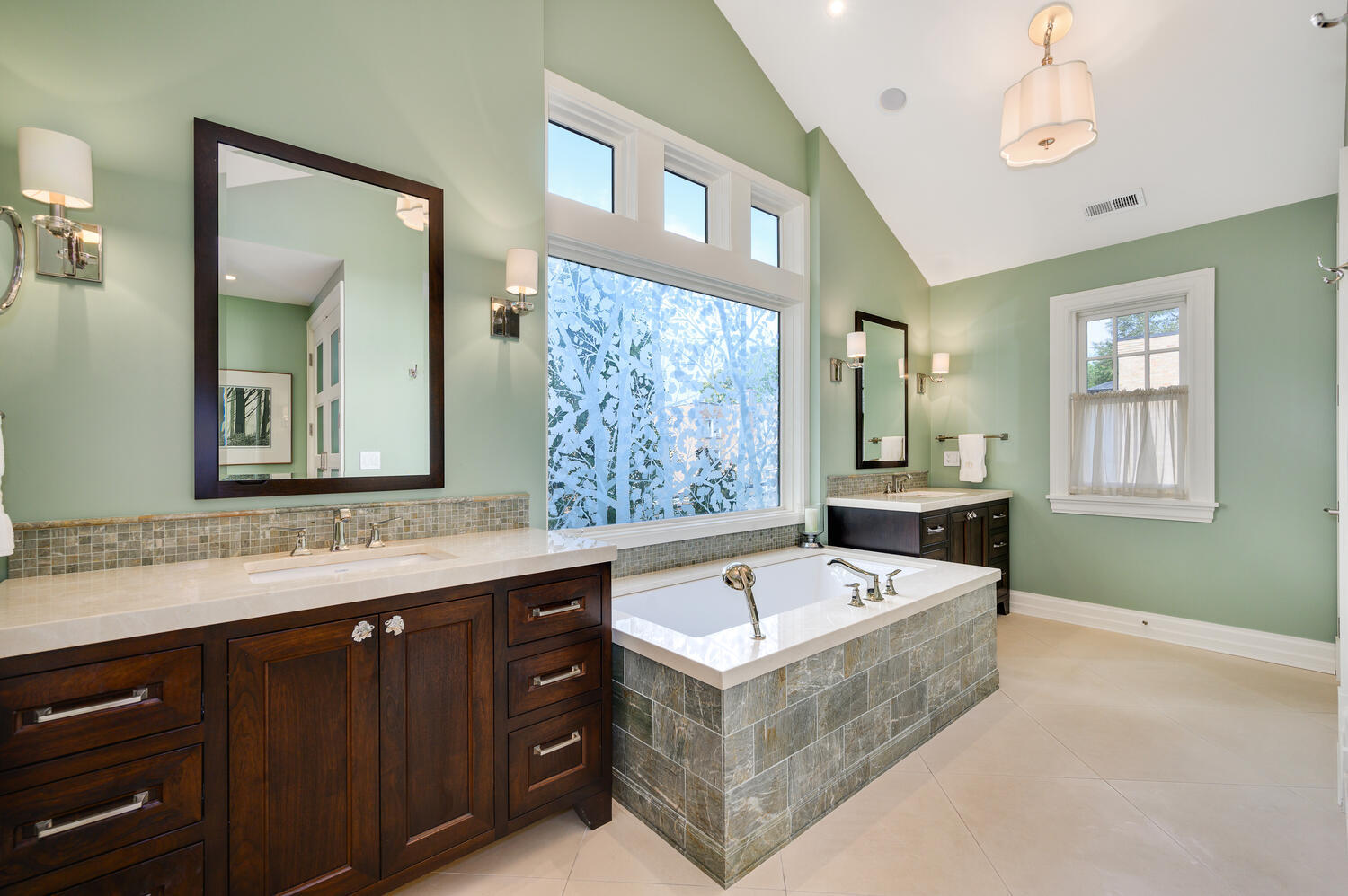 4136 North Greenview Avenue Chicago, IL 60613 - Photo 25 of 56 a bathroom with a tub a double vanity sink a window and a mirror