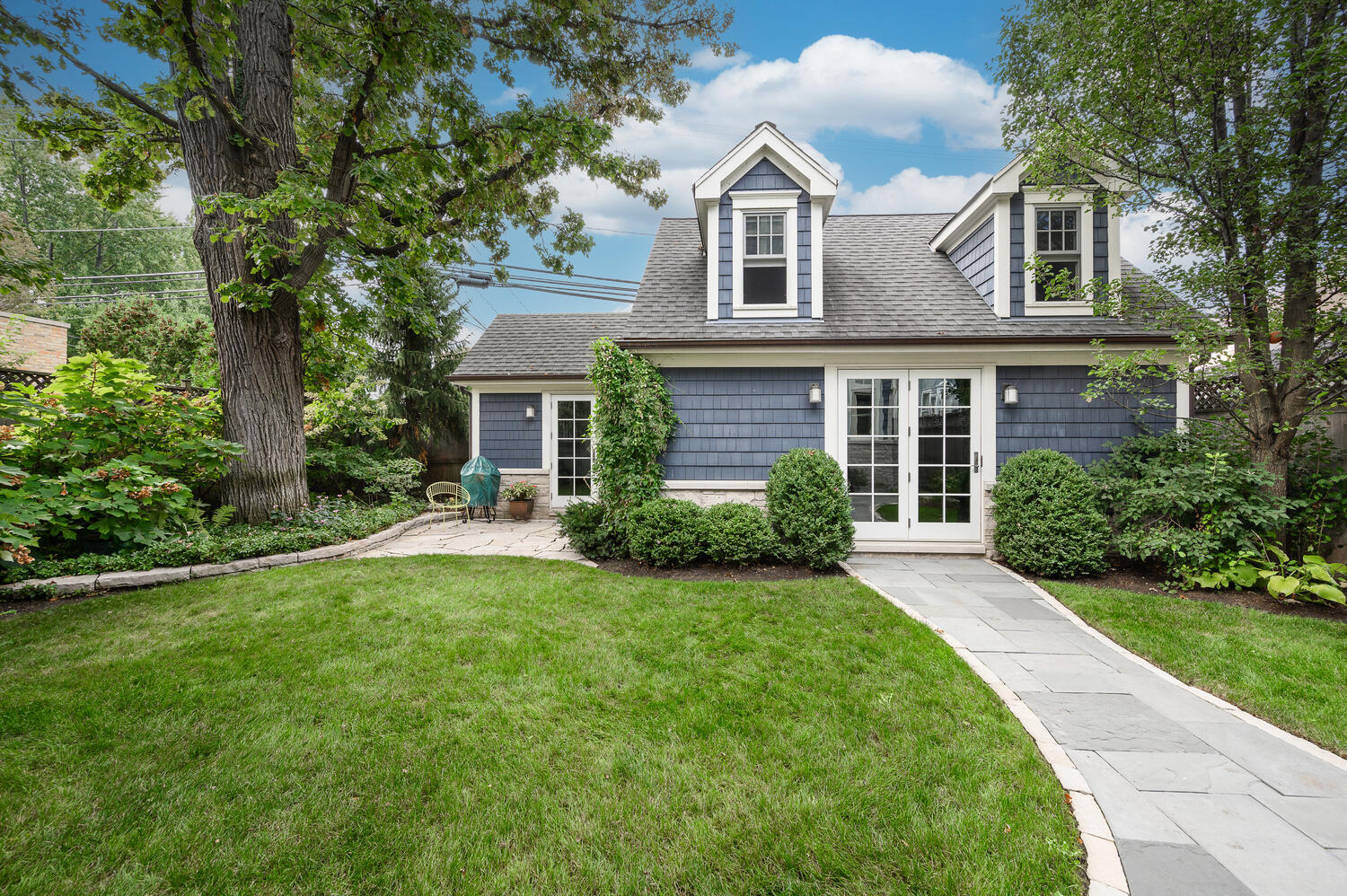 4136 North Greenview Avenue Chicago, IL 60613 - Photo 53 of 56 a front view of a house with a yard