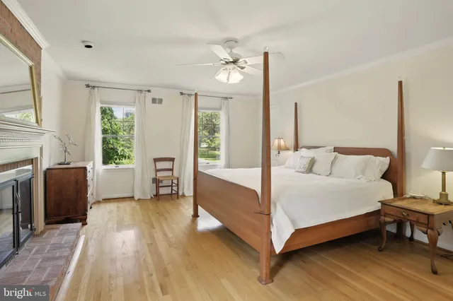 a spacious bedroom with a bed and a couch