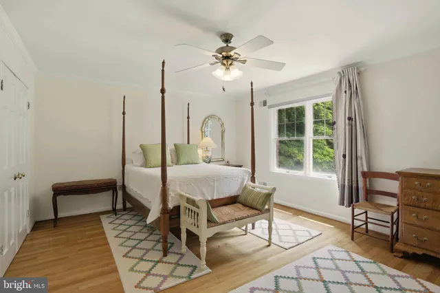 a living room with chairs and a table