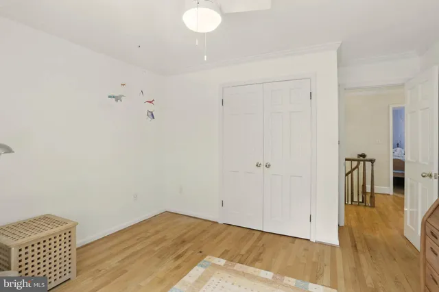 a bedroom with a bed and a table in it