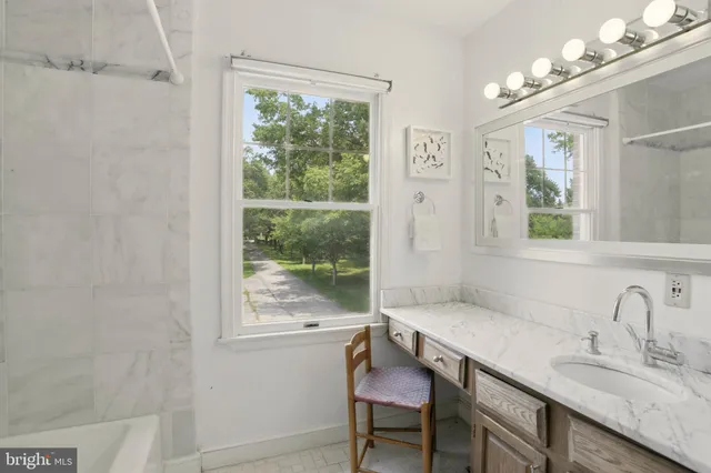 a spacious bedroom with a bed and furniture