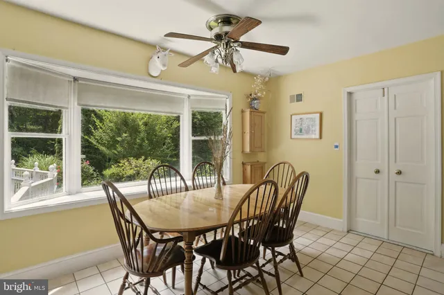 a dining room with furniture and window