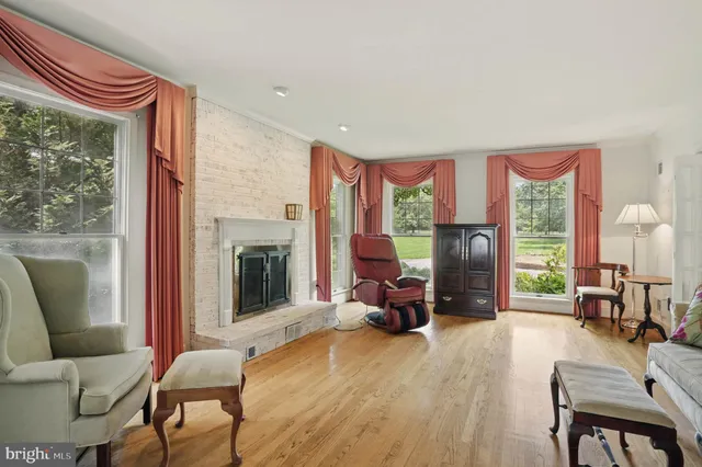 a bedroom with furniture and a fireplace