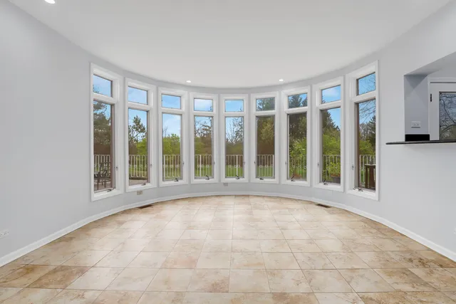 a bathroom with a granite countertop sink mirror and toilet