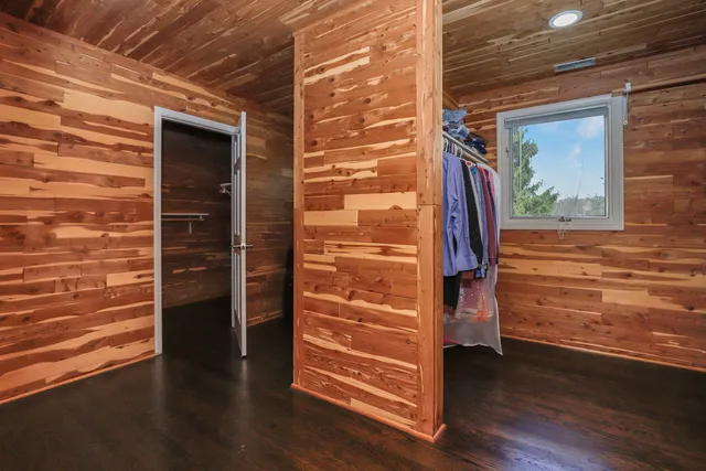 a bathroom with a double vanity sink mirror and shower
