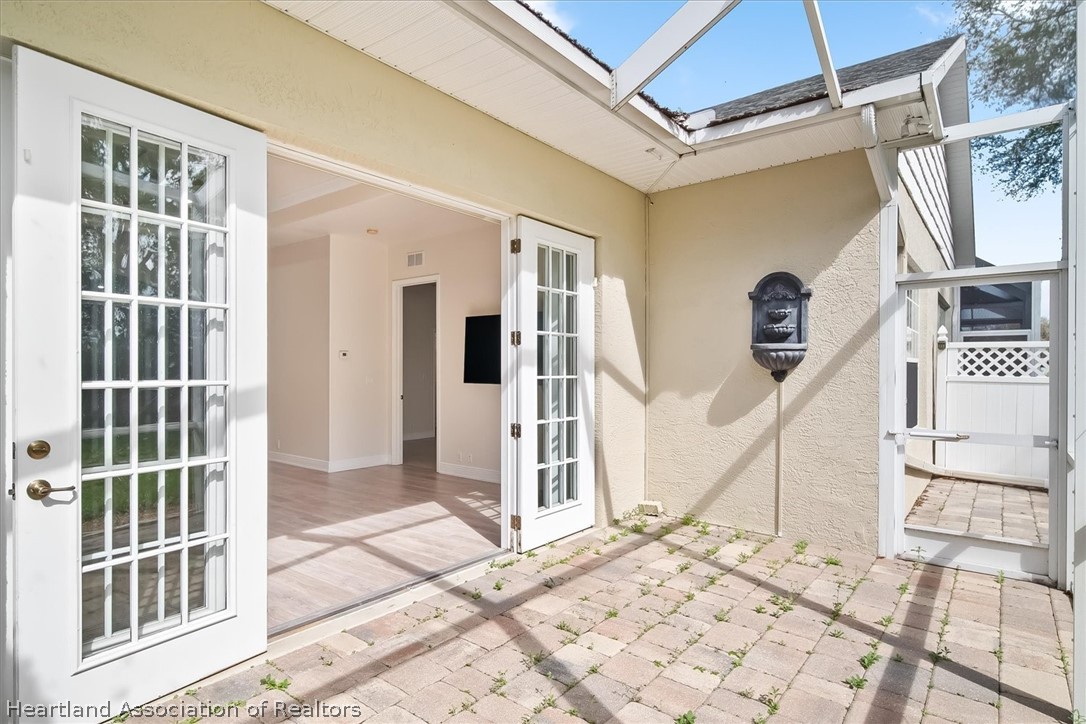 5224 Haw Branch Road Sebring, FL 33875 - Photo 14 of 40 a view of a entryway door of the house