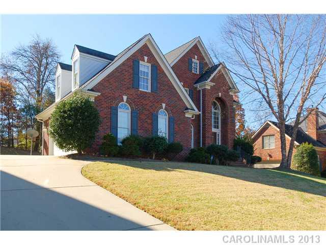 137 Sardis Pointe Road Matthews, NC 28105 - Photo 2 of 16 a front view of a house with garden