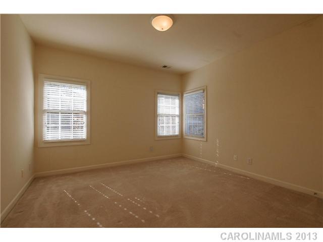 137 Sardis Pointe Road Matthews, NC 28105 - Photo 14 of 16 a view of an empty room with a window