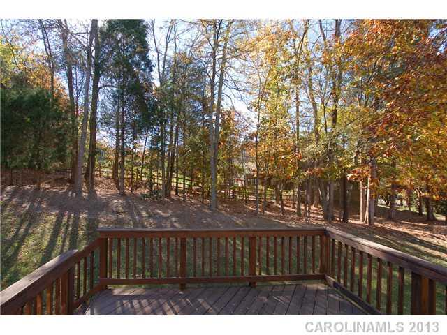137 Sardis Pointe Road Matthews, NC 28105 - Photo 16 of 16 a view of street with wooden fence