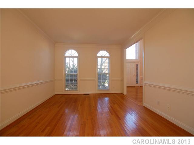 137 Sardis Pointe Road Matthews, NC 28105 - Photo 6 of 16 a view of empty room with wooden floor and fan