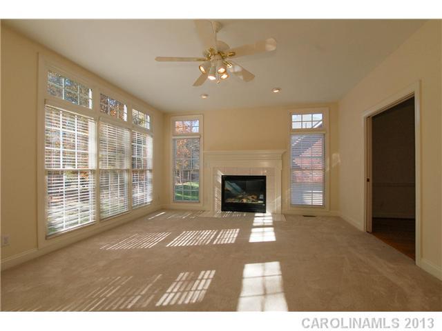 137 Sardis Pointe Road Matthews, NC 28105 - Photo 7 of 16 a living room with furniture and a fireplace
