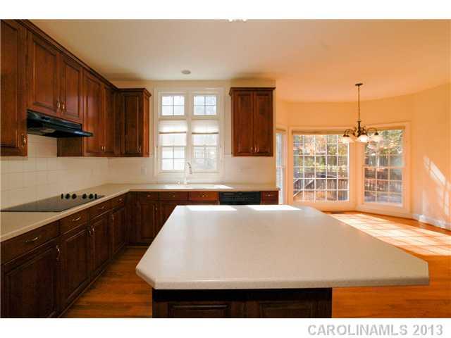 137 Sardis Pointe Road Matthews, NC 28105 - Photo 8 of 16 a kitchen with a sink and large window