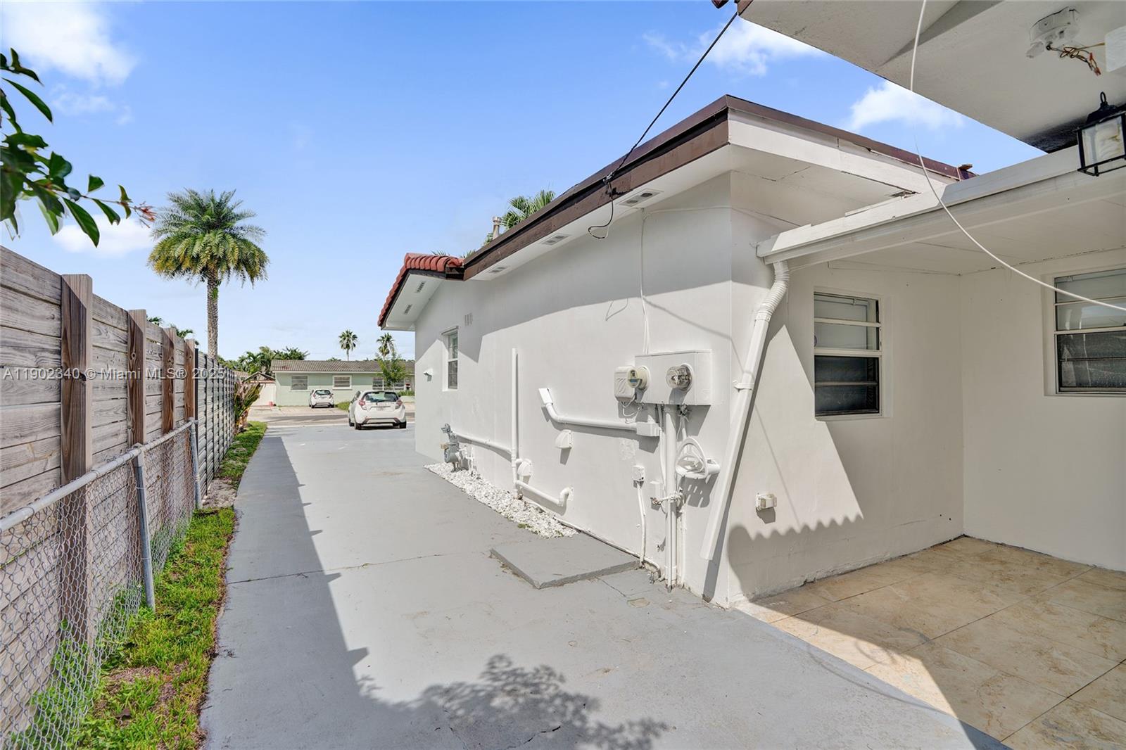 5750 Northwest 111th Street, Unit EFFICIENCY Hialeah, FL 33012 - Photo 26 of 27 a view of a house with a patio
