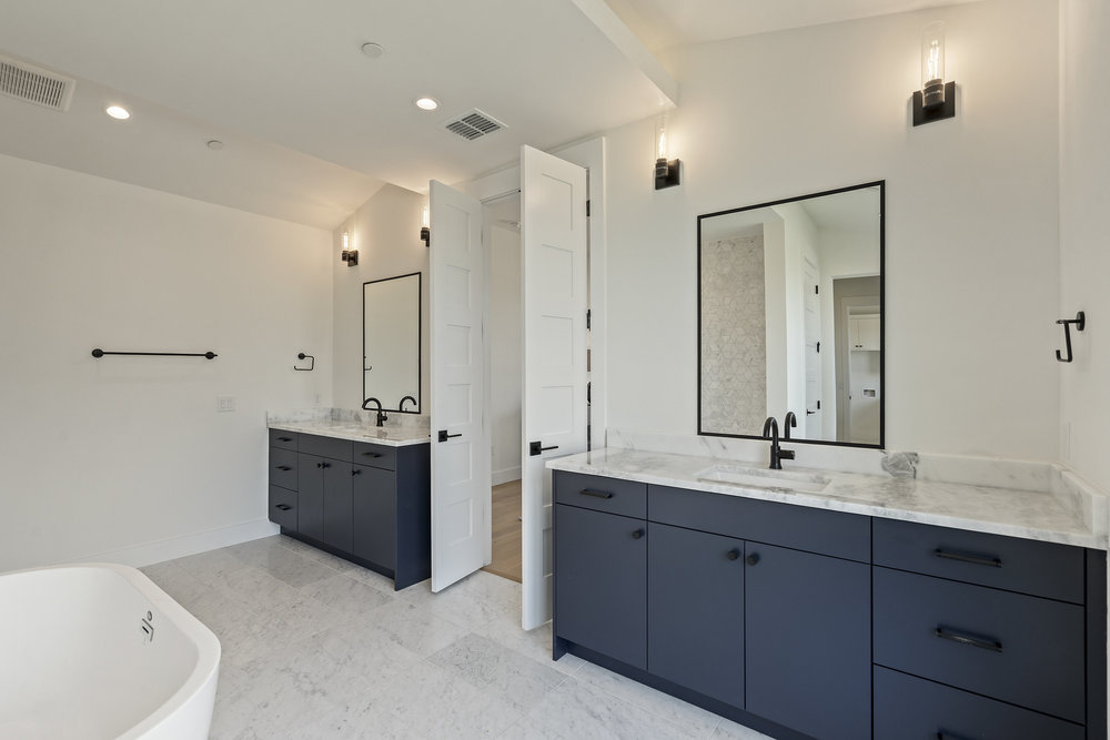 6101 Adhara Pass Austin, TX 78730 - Photo 23 of 40 a spacious bathroom with a double vanity sink mirror and double