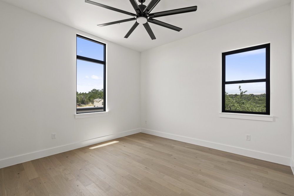 6101 Adhara Pass Austin, TX 78730 - Photo 30 of 40 an empty room with a window and a fan