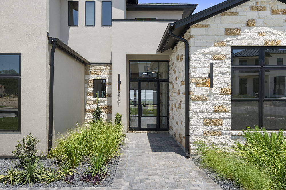 6101 Adhara Pass Austin, TX 78730 - Photo 3 of 40 a hallway with potted plants in front of door