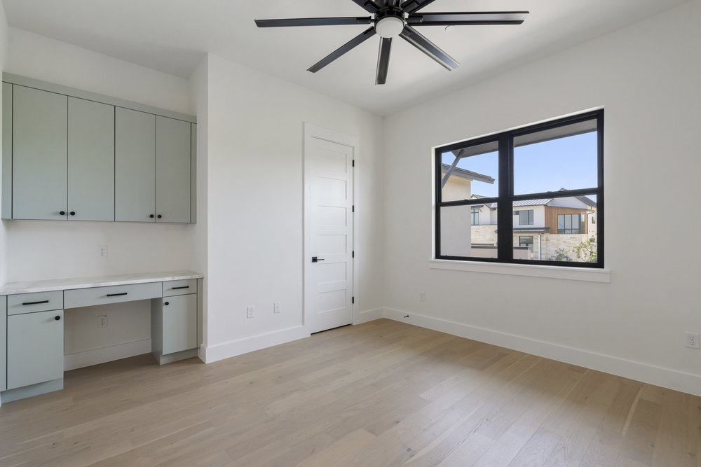 6101 Adhara Pass Austin, TX 78730 - Photo 31 of 40 a view of a livingroom with a ceiling fan and window
