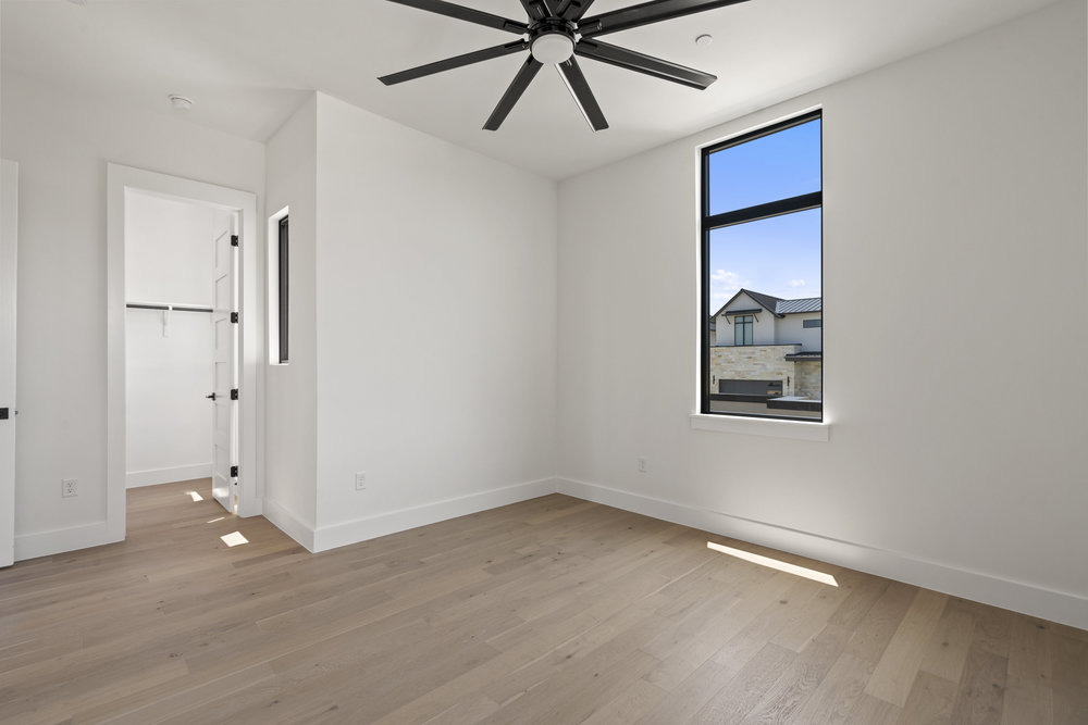 6101 Adhara Pass Austin, TX 78730 - Photo 33 of 40 a view of an empty room with window and wooden floor