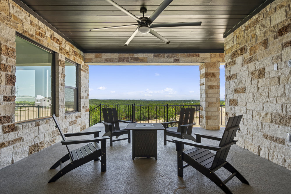 6101 Adhara Pass Austin, TX 78730 - Photo 9 of 40 a outdoor space with patio lots of furniture and a fireplace
