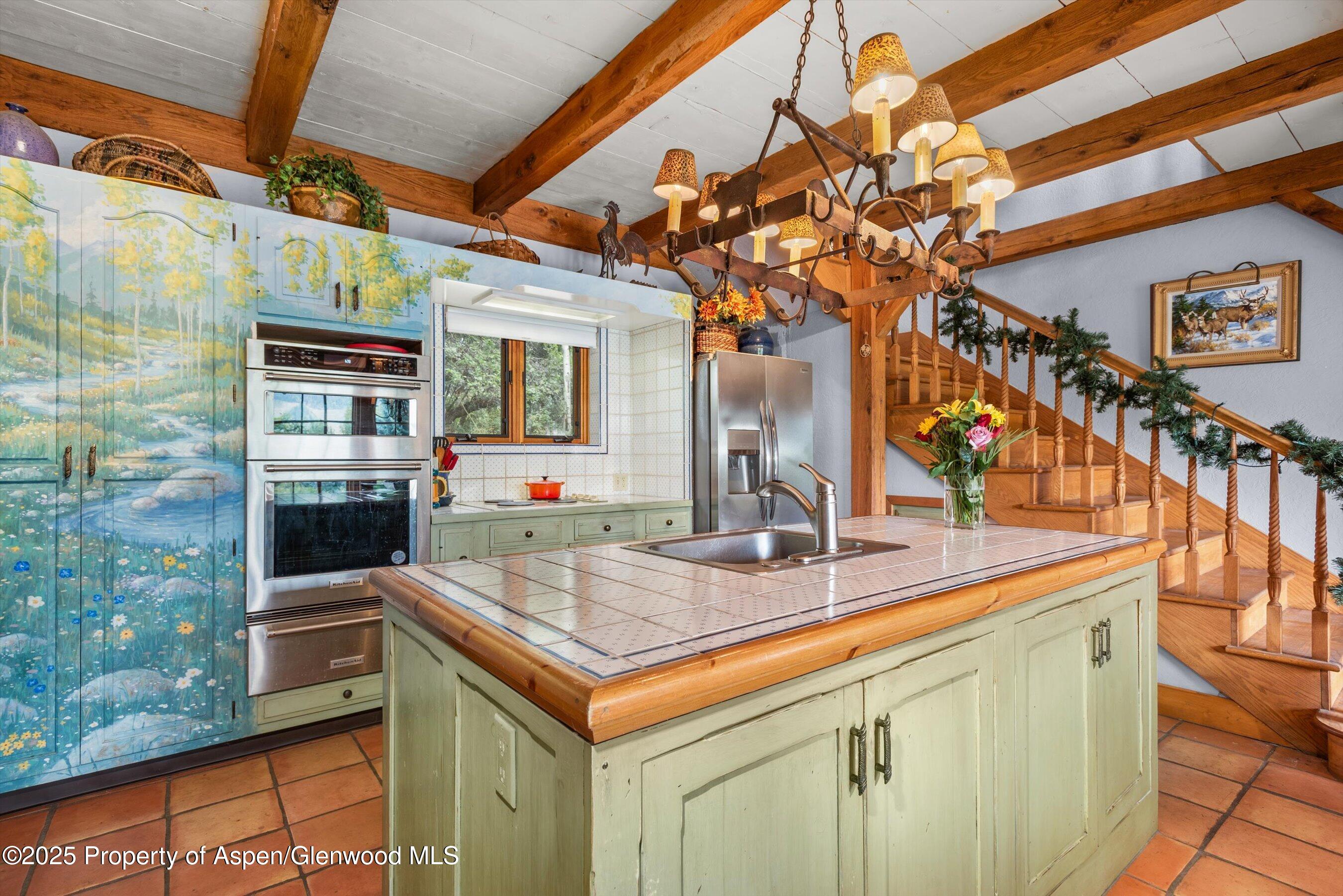 927 Red Mountain Road Aspen, CO 81612 - Photo 14 of 37 a bathroom with a sink a mirror and shower