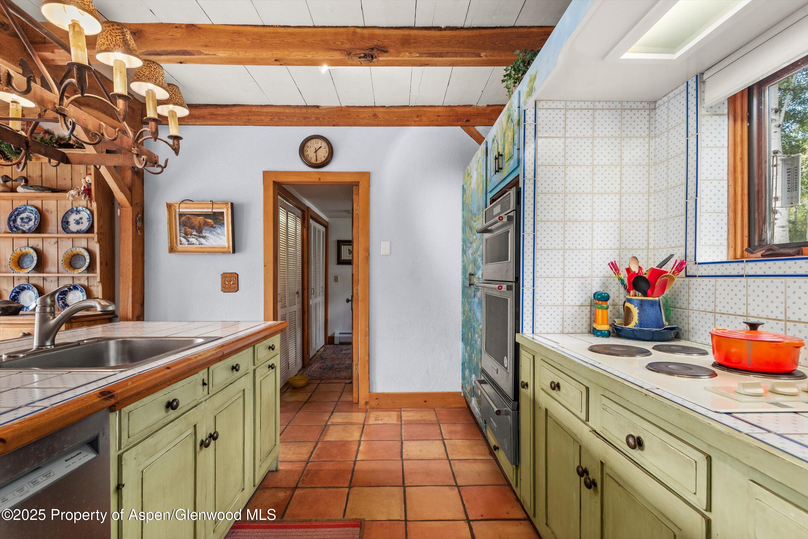 927 Red Mountain Road Aspen, CO 81612 - Photo 15 of 37 a spacious bathroom with a sink and a mirror