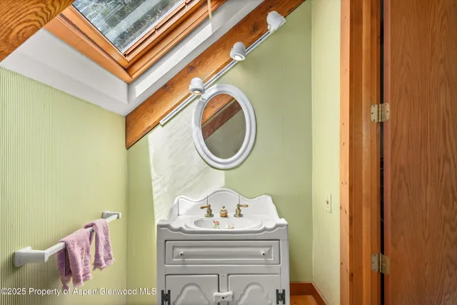 a view of a balcony with wooden fence and floor