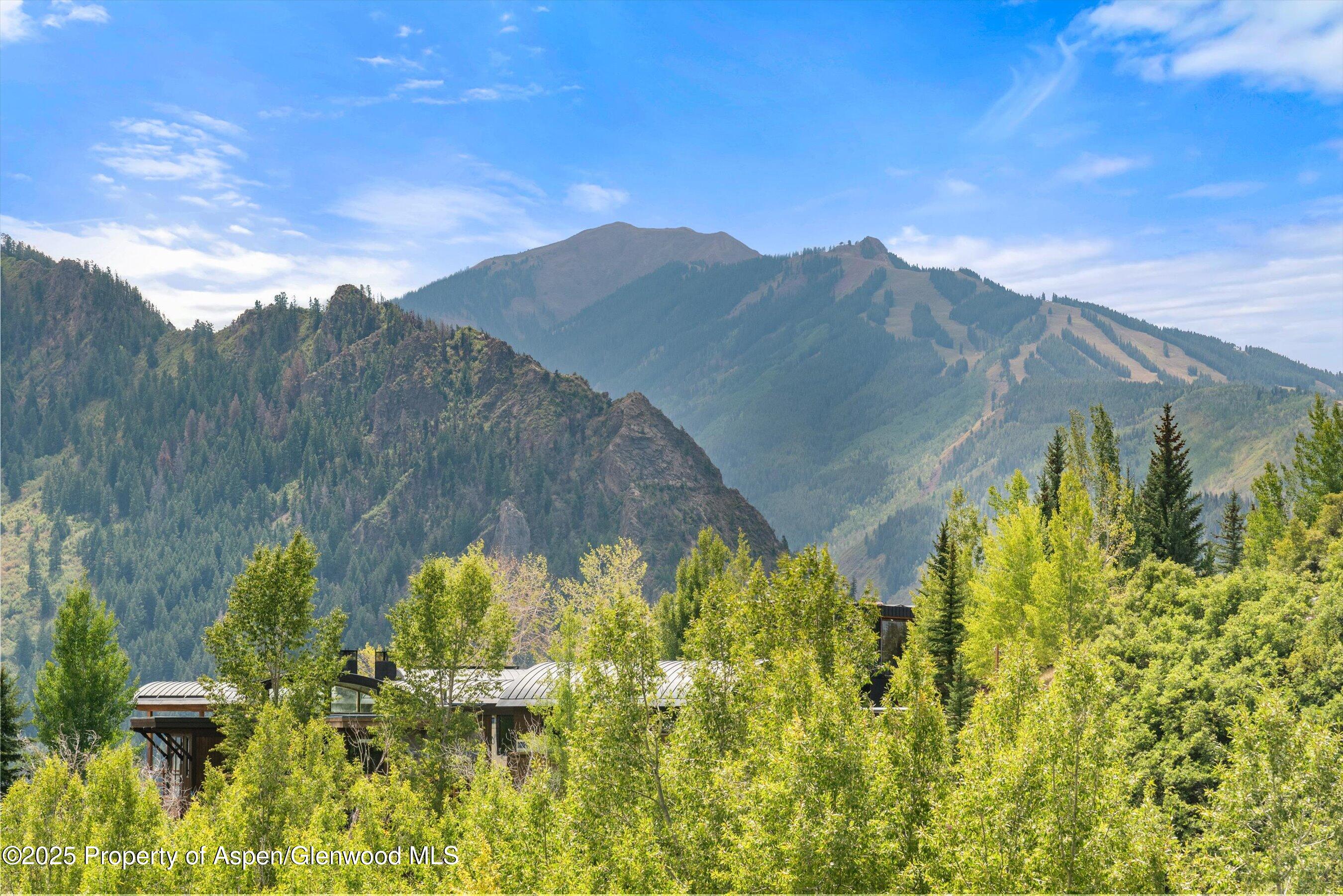 927 Red Mountain Road Aspen, CO 81612 - Photo 29 of 37 a view of a lake with a mountain in the background