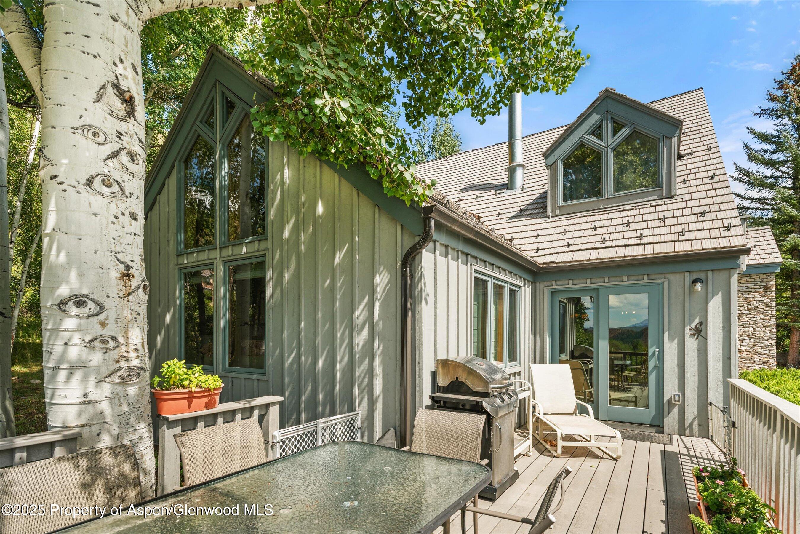927 Red Mountain Road Aspen, CO 81612 - Photo 33 of 37 an outdoor view of house with outdoor seating