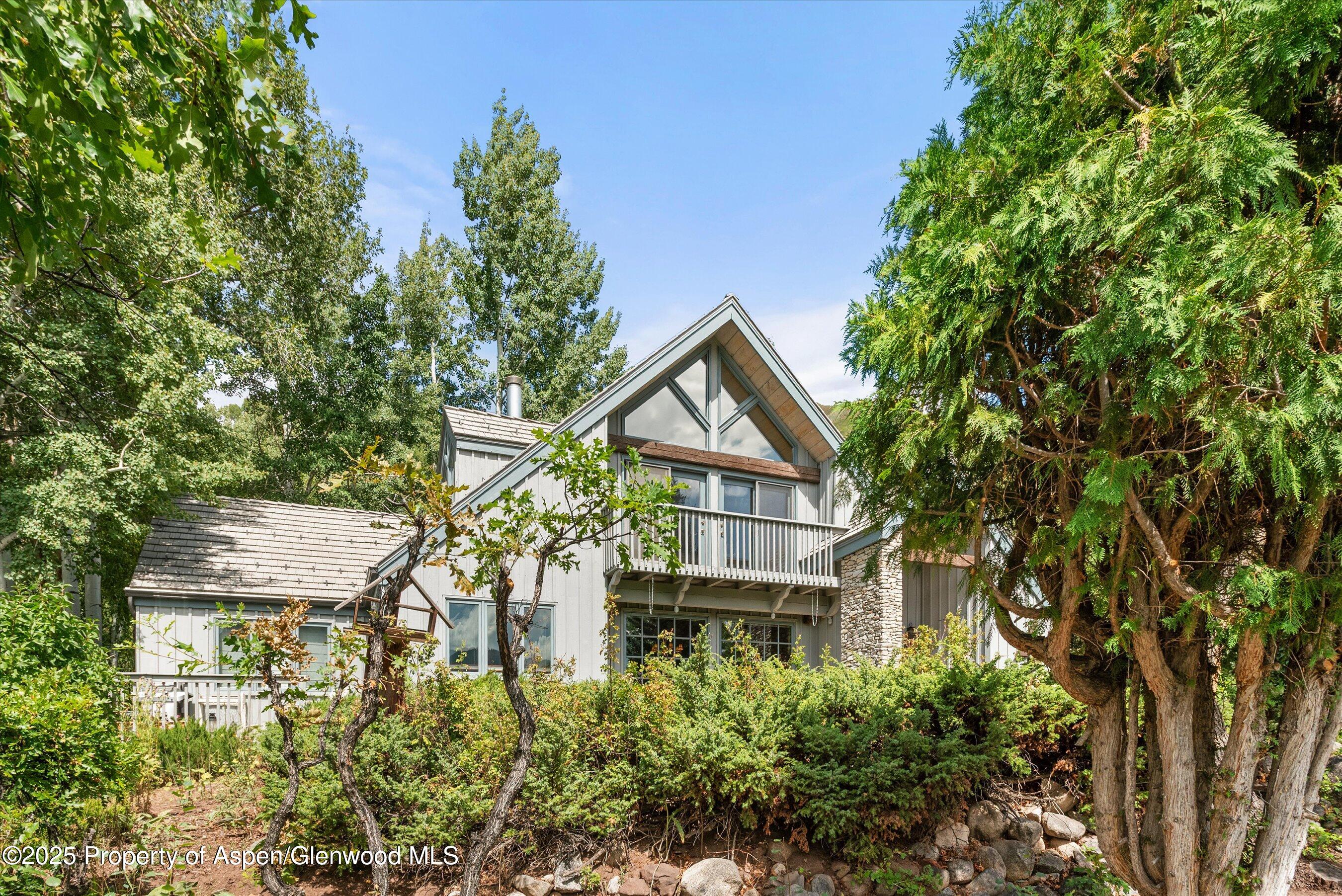 927 Red Mountain Road Aspen, CO 81612 - Photo 35 of 37 a house with trees in front of it