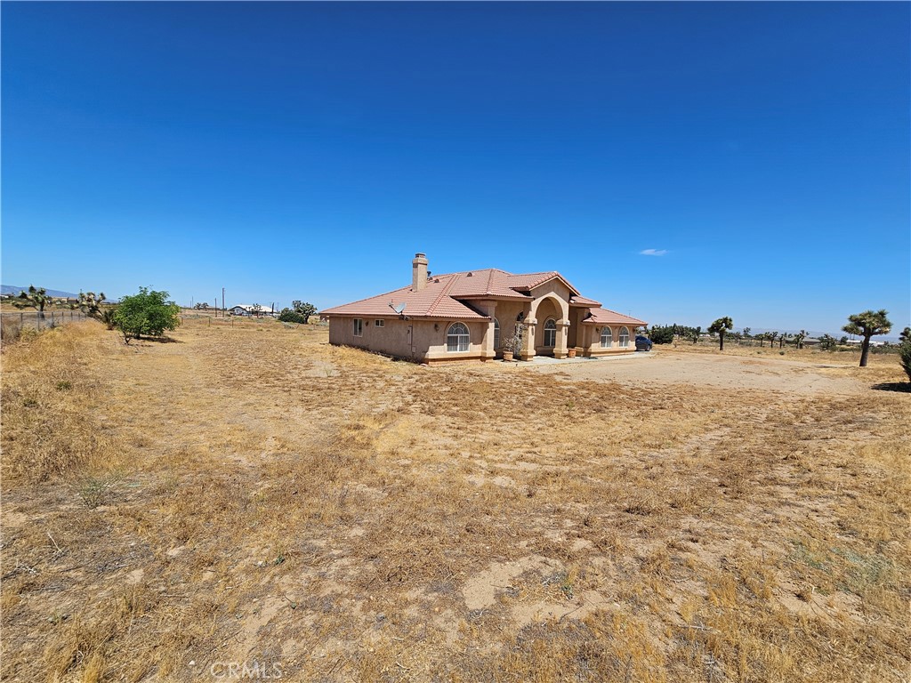 7677 Solano Road Phelan, CA 92371 - Photo 1 of 1 a white house with a ocean view