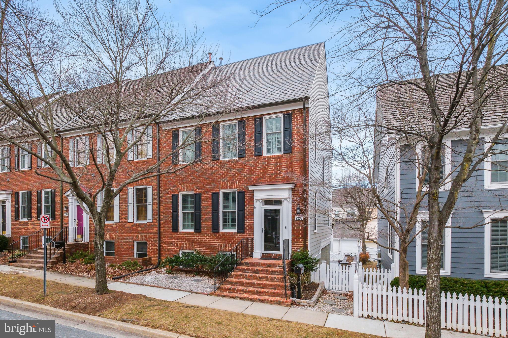 220 Thaxton Street Gaithersburg, MD 20878 - Photo 1 of 61 a front view of a house with a yard